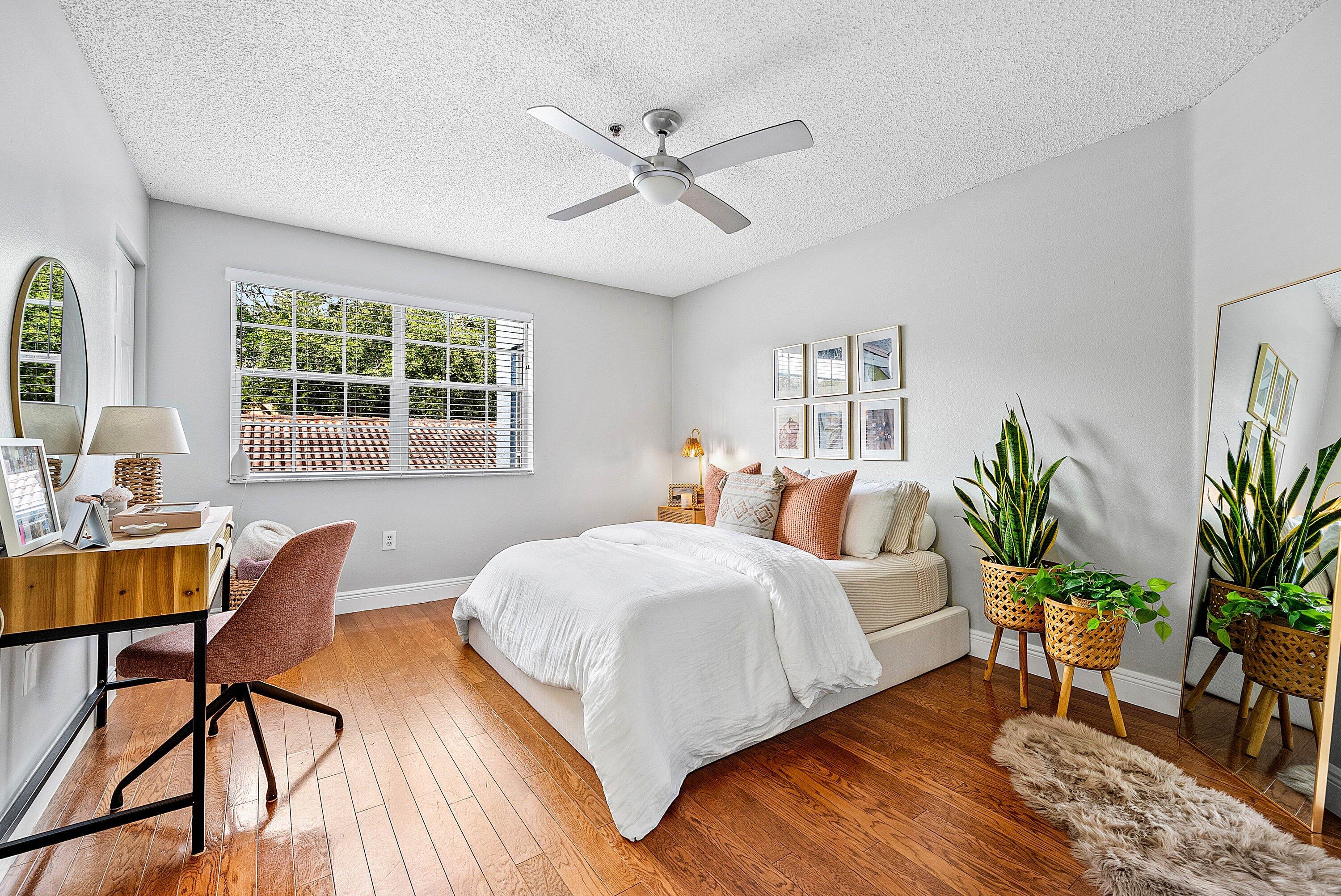 Undisclosed Address Boca Raton, FL 33496 - Photo 23 of 46 a bedroom with a bed and a table