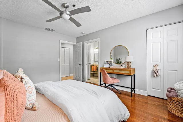 a bedroom with a bed and a table