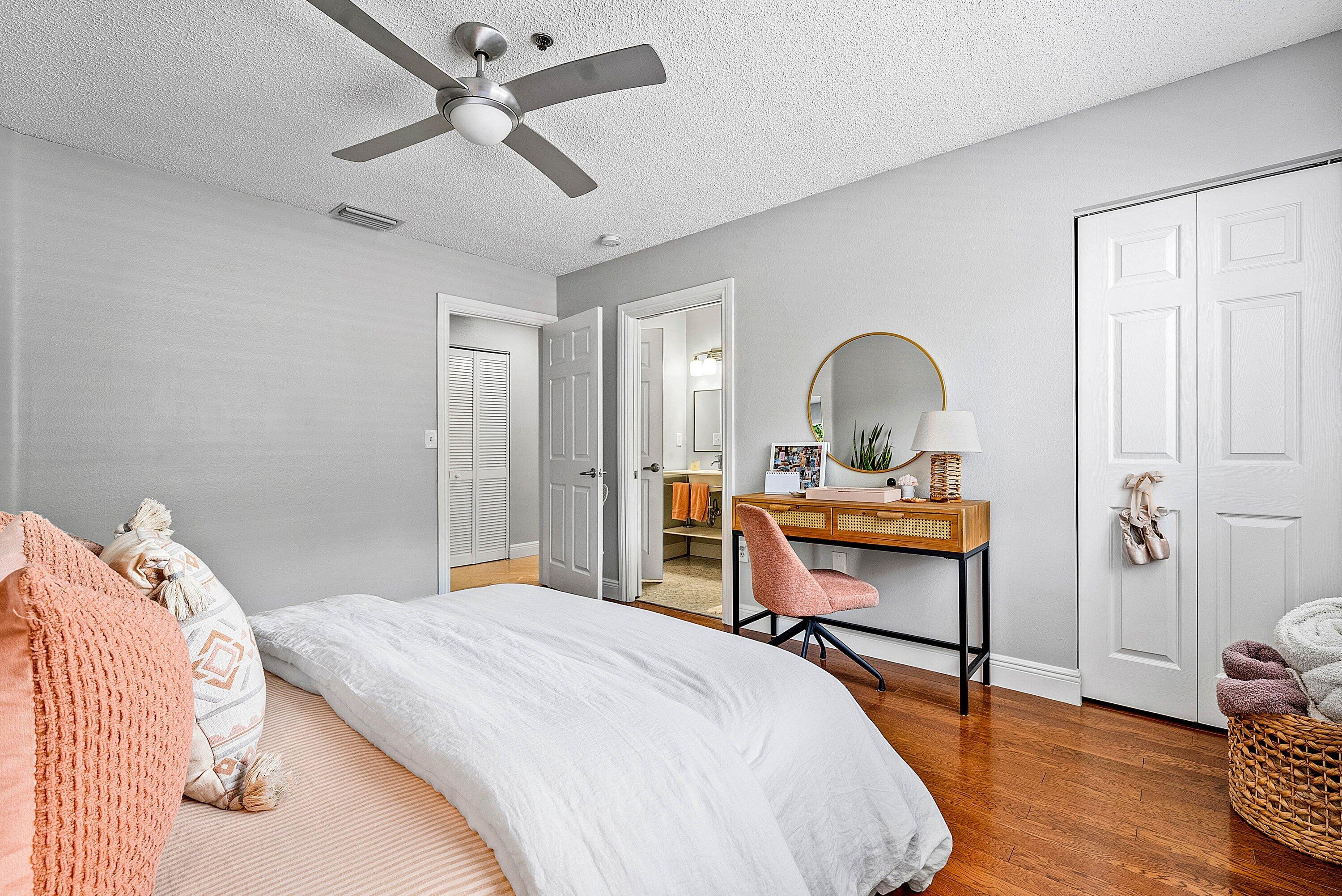 Undisclosed Address Boca Raton, FL 33496 - Photo 24 of 46 a bedroom with a bed and a table