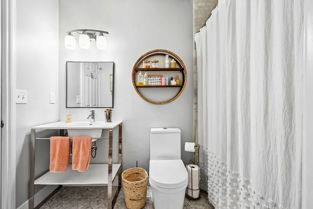 a bathroom with a toilet and a sink