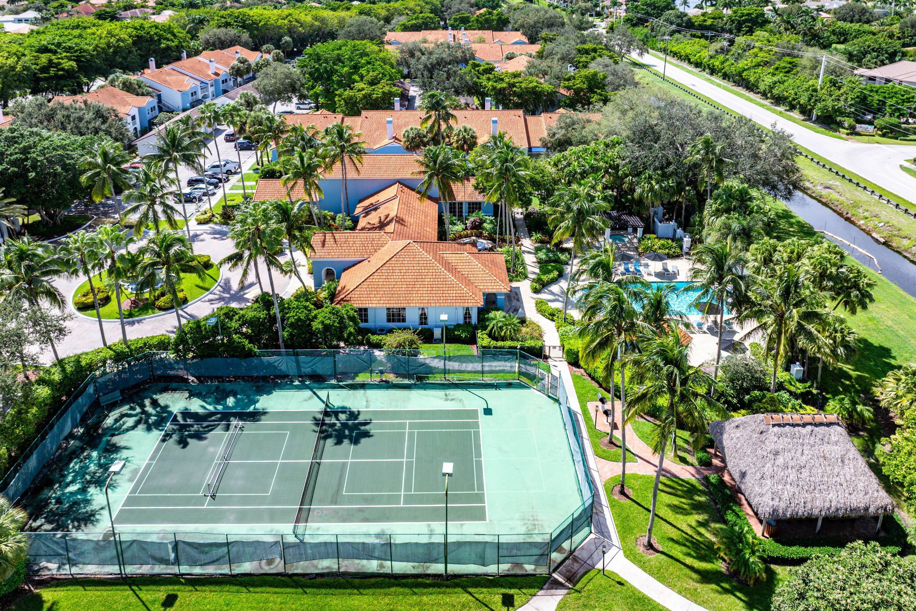 Undisclosed Address Boca Raton, FL 33496 - Photo 35 of 46 a view of a swimming pool with a yard and plants