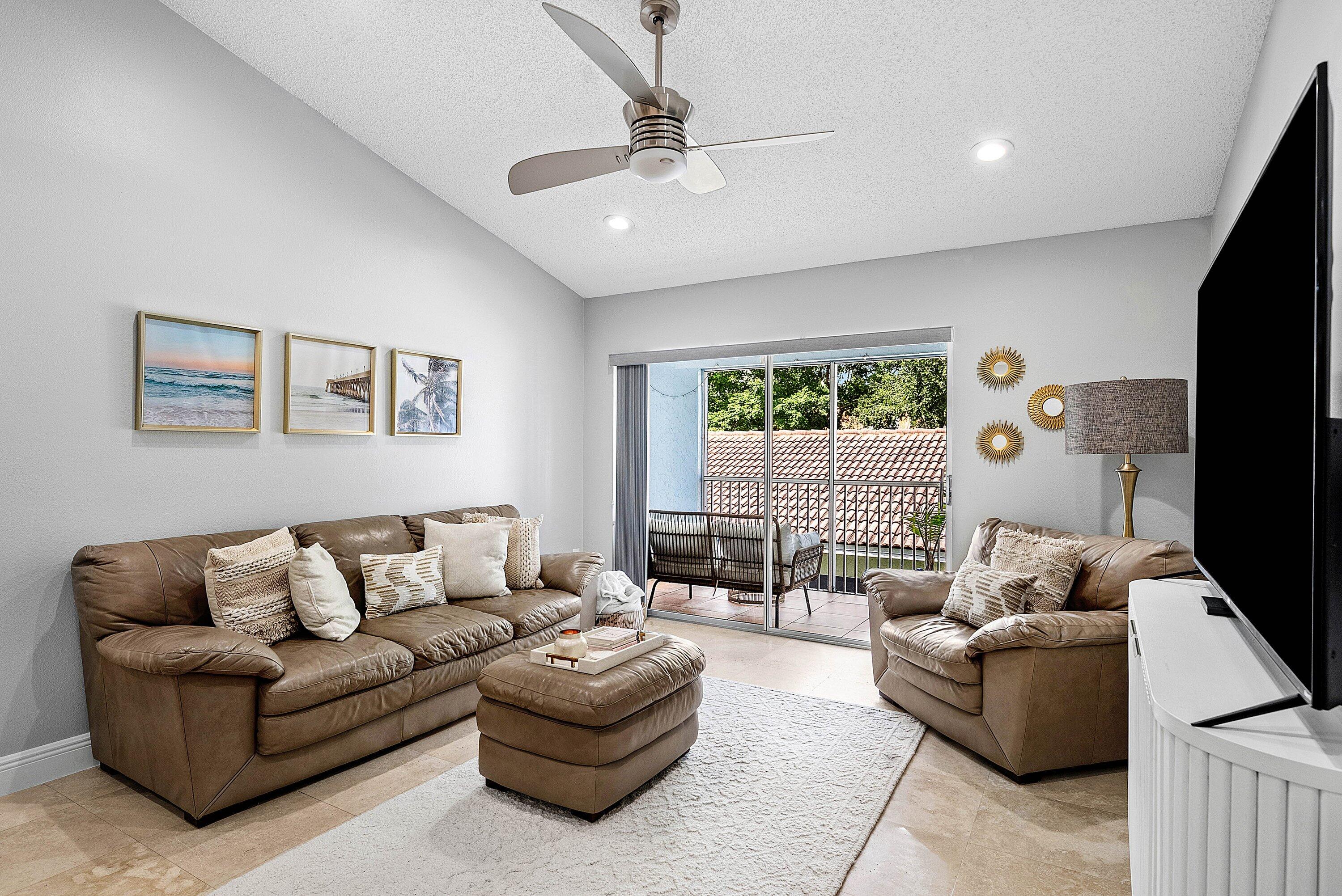 Undisclosed Address Boca Raton, FL 33496 - Photo 4 of 46 a living room with furniture and a large window