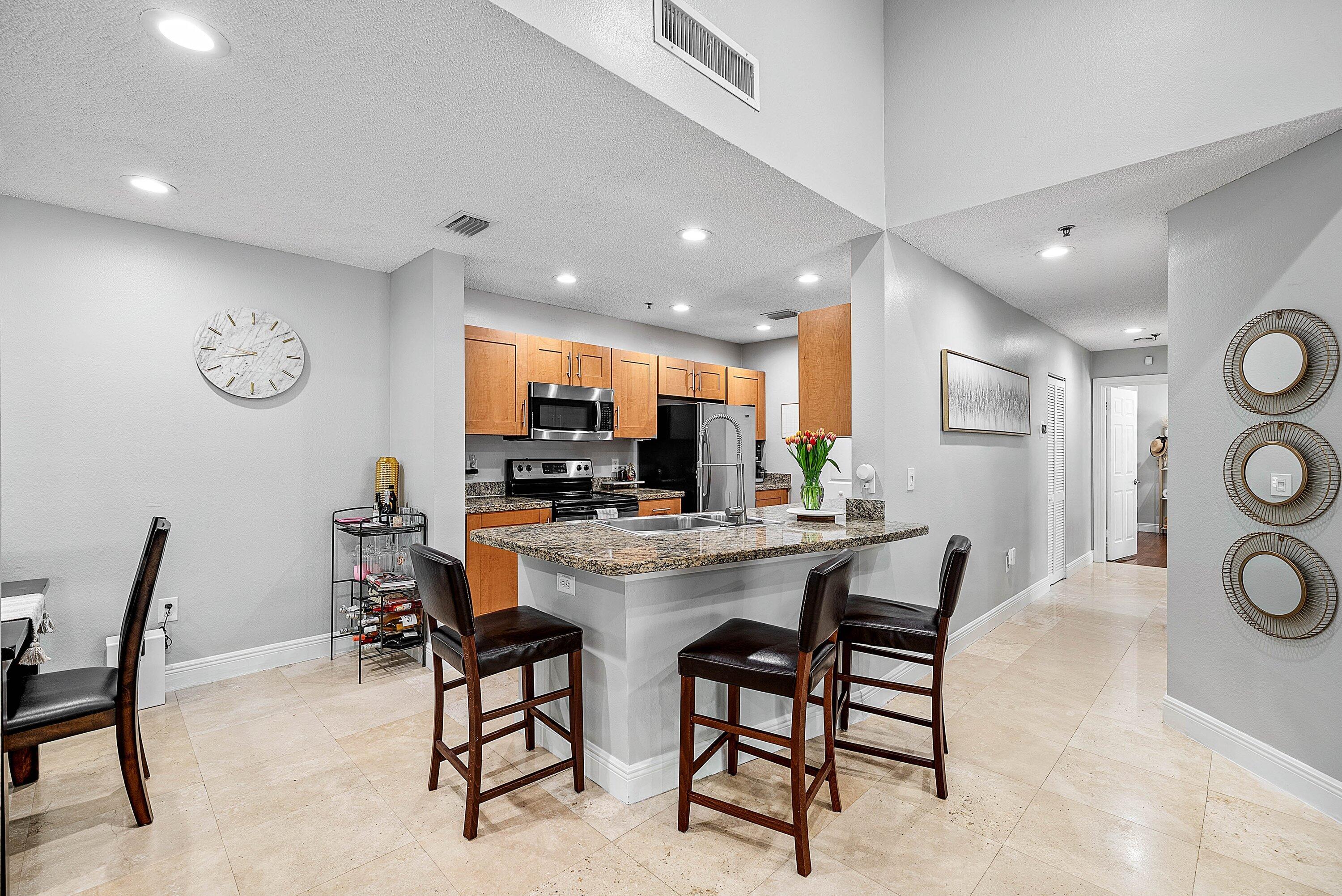 Undisclosed Address Boca Raton, FL 33496 - Photo 7 of 46 a view of a dining area with furniture and a large window