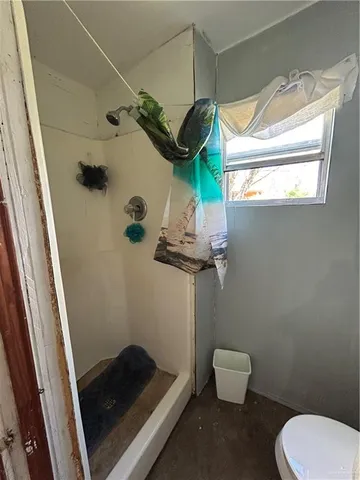 a bathroom with a toilet and a sink