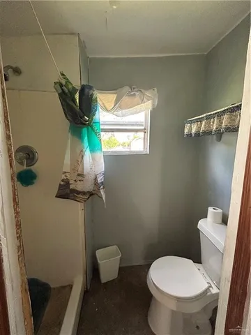a bathroom with a toilet and a sink