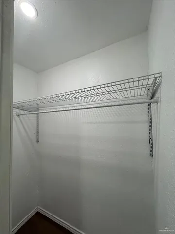 a view of a room with racks on the wall