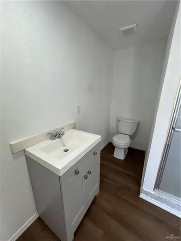 a bathroom with a sink toilet and vanity