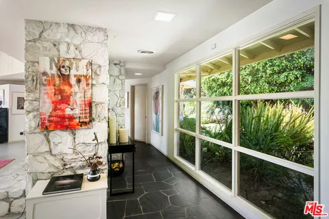 a view of living room with furniture and flat screen tv