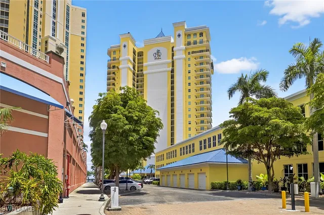 a view of a tall building next to a road