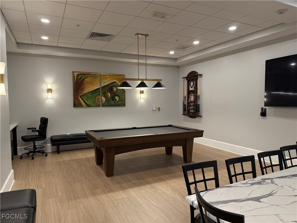 2797 First Street, Unit 2004 Fort Myers, FL 33916 - Photo 33 of 41 a living room with furniture pool table and a flat screen tv