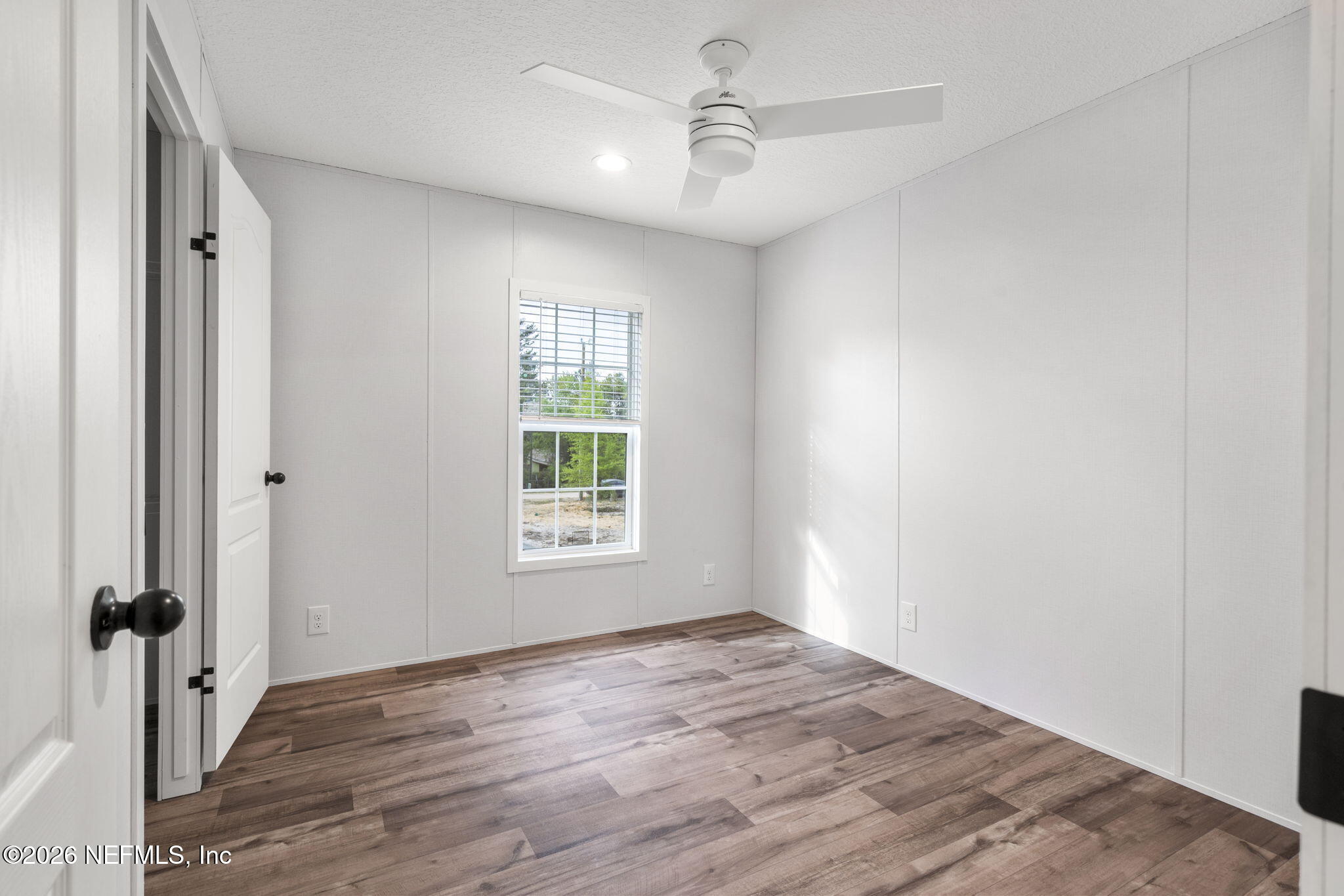 110 Slipper Way Hawthorne, FL 32640 - Photo 20 of 42 wooden floor in an empty room with a window