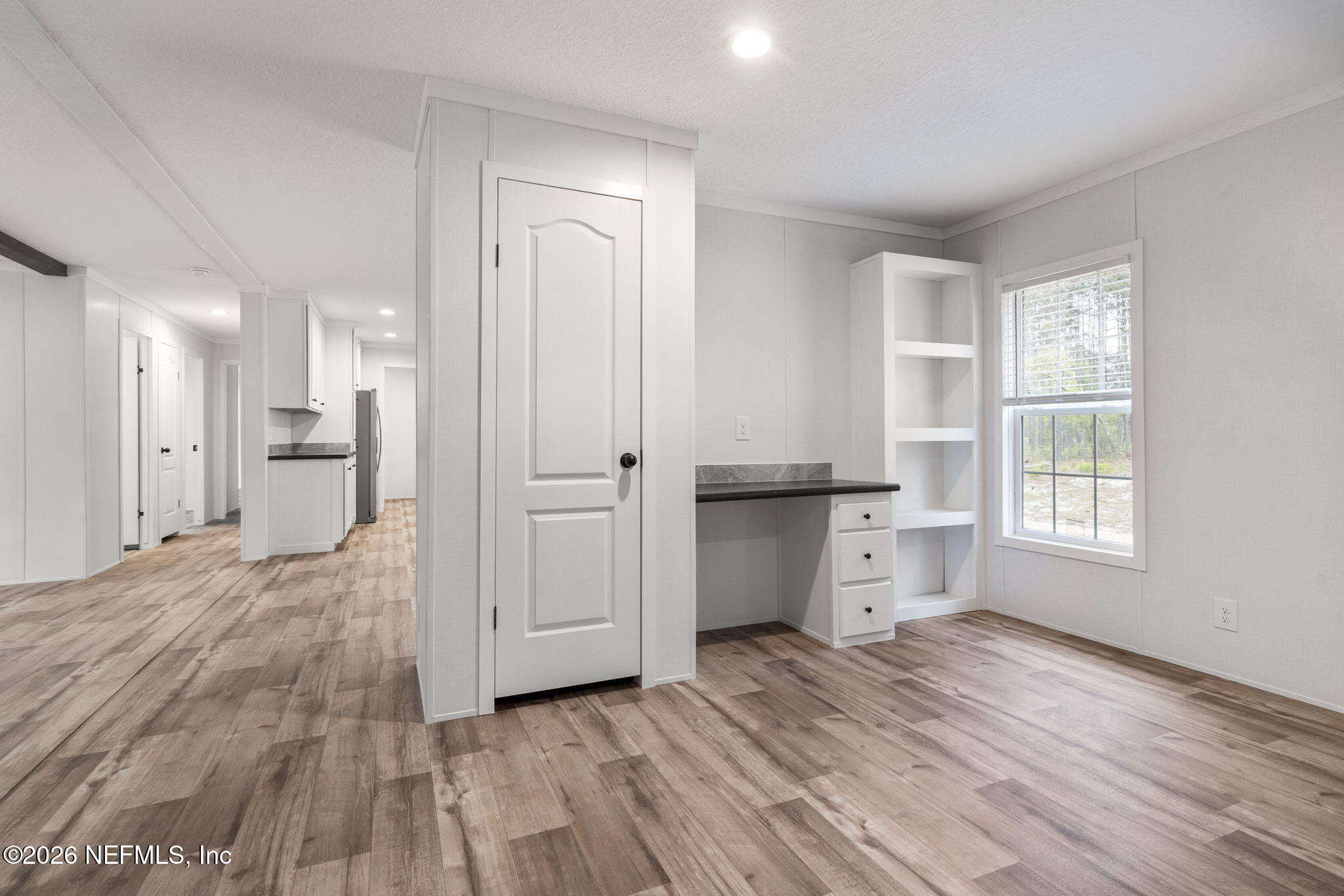 110 Slipper Way Hawthorne, FL 32640 - Photo 25 of 42 a view of empty room with wooden floor and window