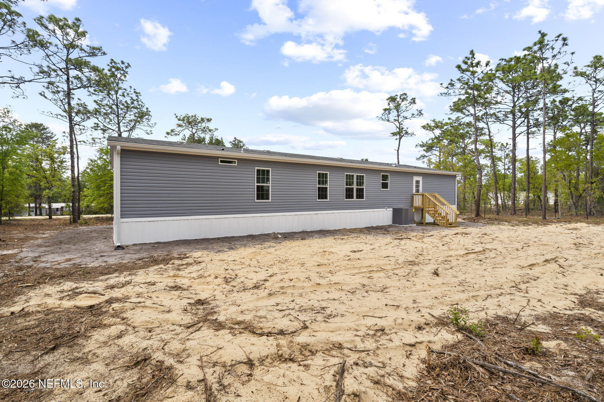 110 Slipper Way Hawthorne, FL 32640 - Photo 39 of 42 a backyard of a house with large trees