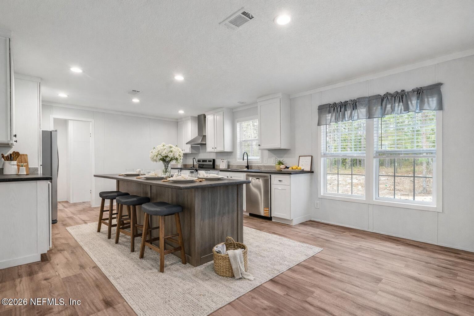 110 Slipper Way Hawthorne, FL 32640 - Photo 5 of 42 a kitchen with a sink cabinets and window