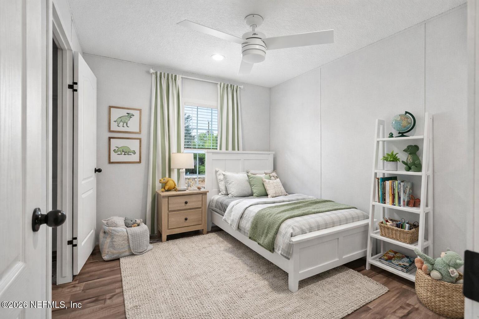 110 Slipper Way Hawthorne, FL 32640 - Photo 6 of 42 a bedroom with a bed and a book shelf