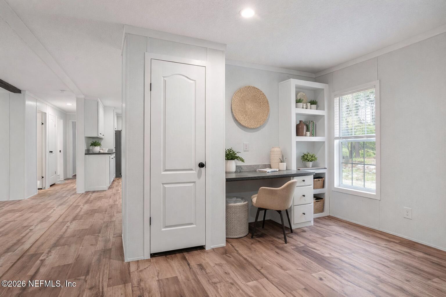 110 Slipper Way Hawthorne, FL 32640 - Photo 10 of 42 a living room with a bed furniture and a window