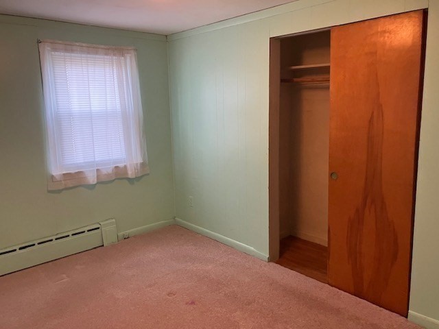 14 Birchwood Road Southwick, MA 01077 - Photo 20 of 25 an empty room with windows and closet