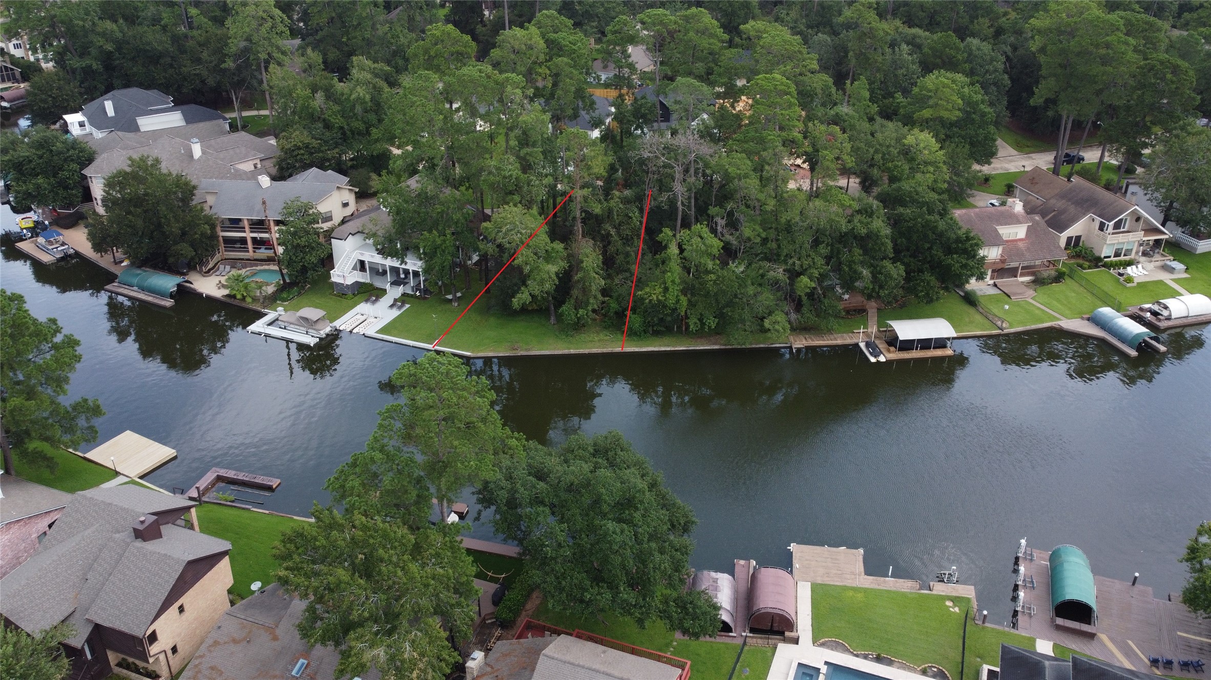 an aerial view of residential house with outdoor space and lake view