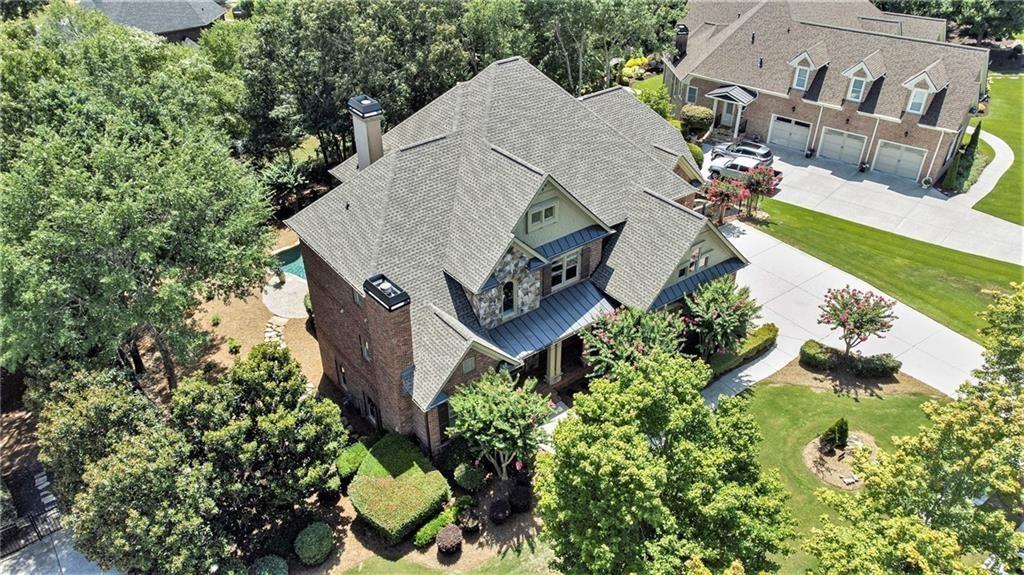 2317 Crimson King Drive Braselton, GA 30517 - Photo 38 of 66 an aerial view of a house with a yard and garden