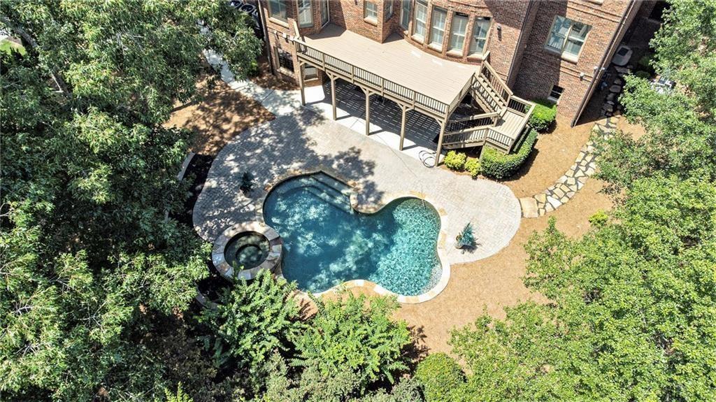 2317 Crimson King Drive Braselton, GA 30517 - Photo 45 of 66 an aerial view of a house with a yard and trees