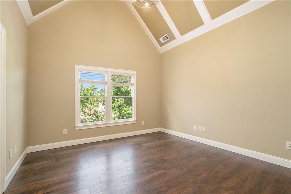 2317 Crimson King Drive Braselton, GA 30517 - Photo 50 of 66 an empty room with wooden floor and windows