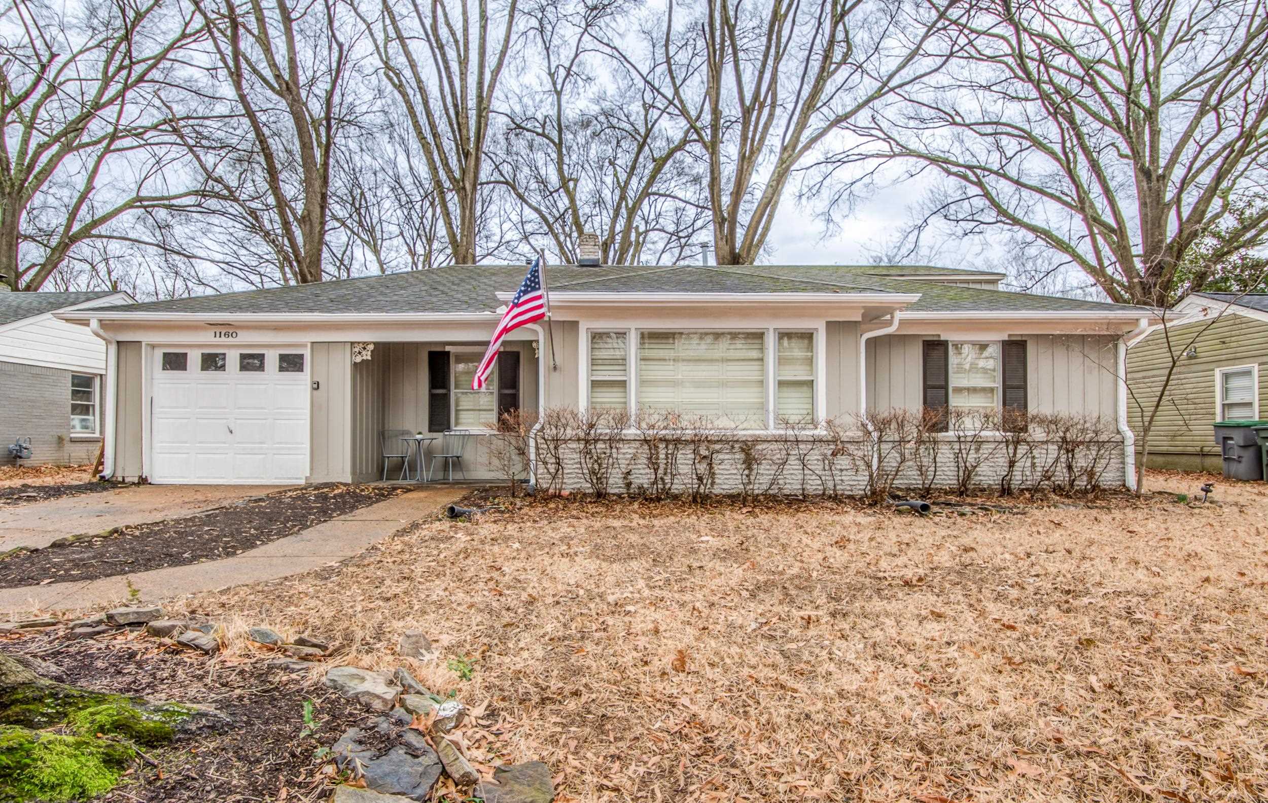 1160 West Perkins Road Memphis, TN 38117 - Photo 1 of 19 a front view of a house with a garden