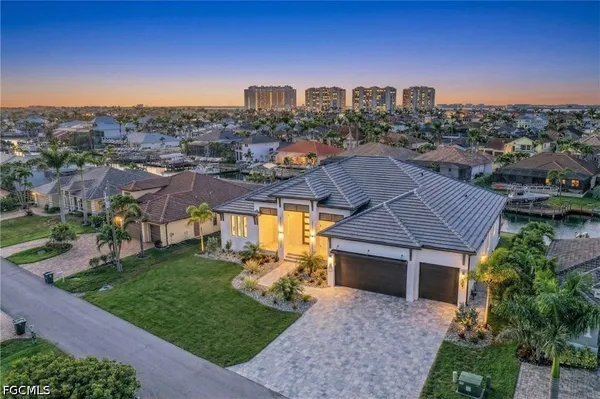 an aerial view of a house with a garden