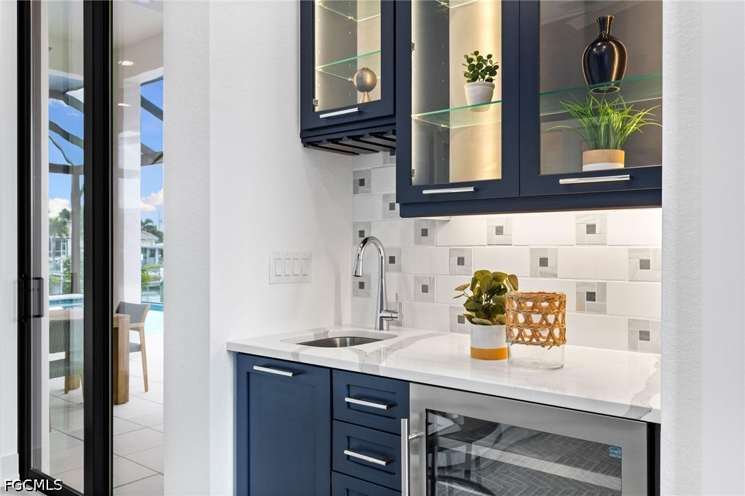 1524 Southwest 57th Street Cape Coral, FL 33914 - Photo 16 of 45 a kitchen with a sink and a window