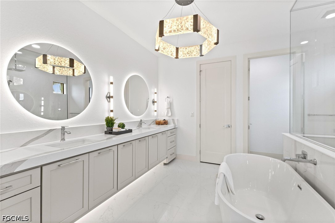 1524 Southwest 57th Street Cape Coral, FL 33914 - Photo 26 of 45 a bathroom with a double vanity sink and a mirror