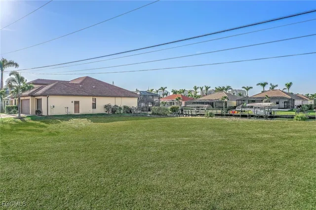 a view of a city with tall buildings and a big yard