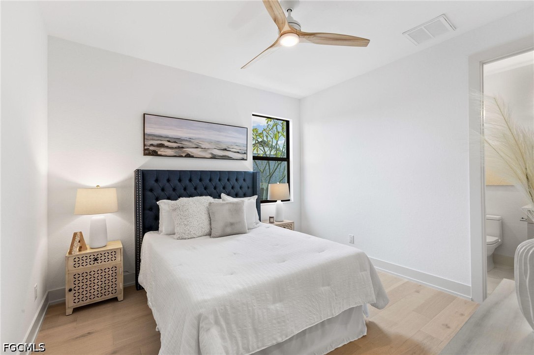 1524 Southwest 57th Street Cape Coral, FL 33914 - Photo 28 of 45 a bedroom with a bed and a painting