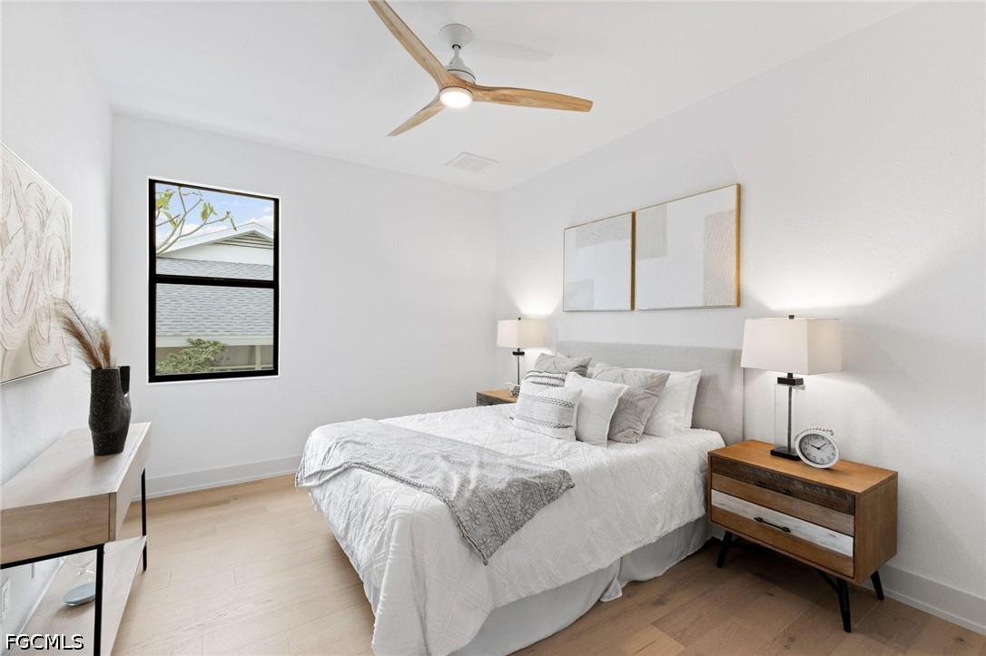 1524 Southwest 57th Street Cape Coral, FL 33914 - Photo 29 of 45 a bedroom with a bed and a window