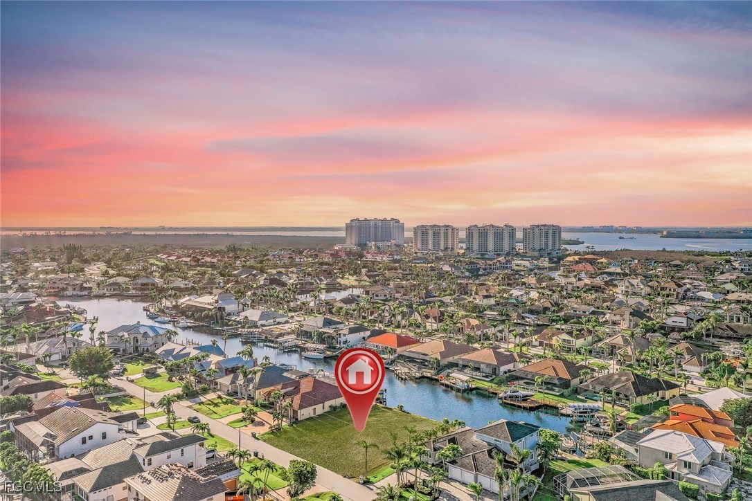 1524 Southwest 57th Street Cape Coral, FL 33914 - Photo 3 of 45 an aerial view of a city with lots of residential buildings