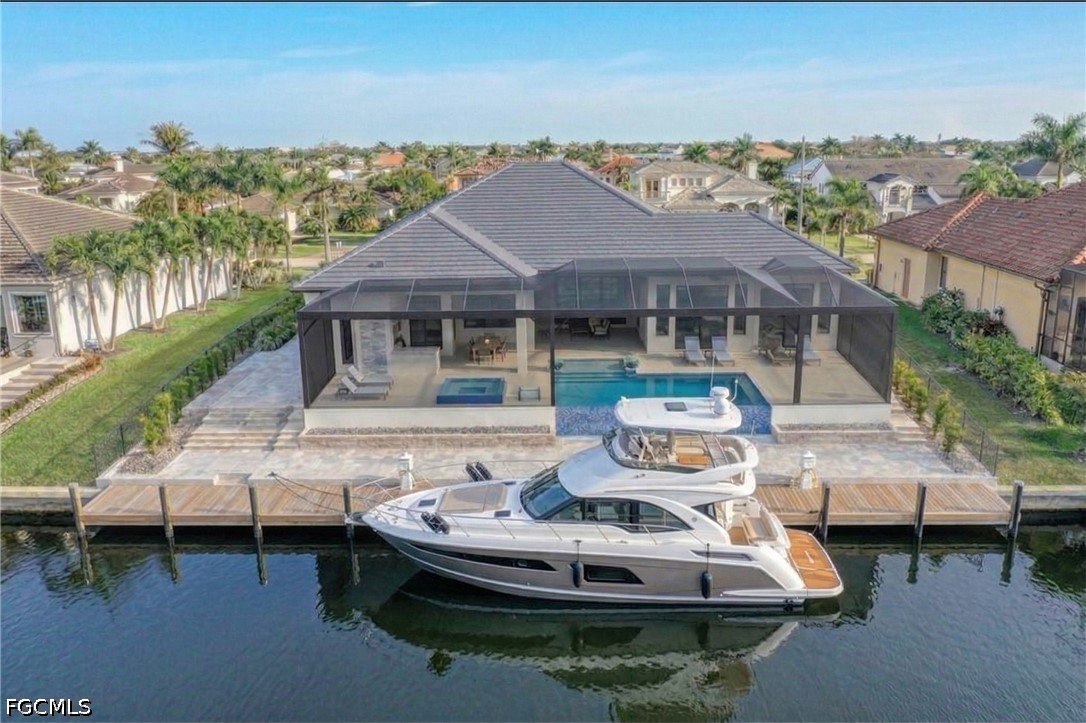 1524 Southwest 57th Street Cape Coral, FL 33914 - Photo 31 of 45 a view of a house with pool table and chairs