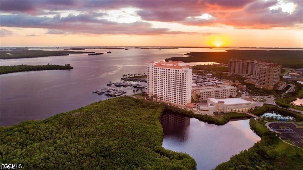 1524 Southwest 57th Street Cape Coral, FL 33914 - Photo 39 of 45 a view of a lake with tall buildings