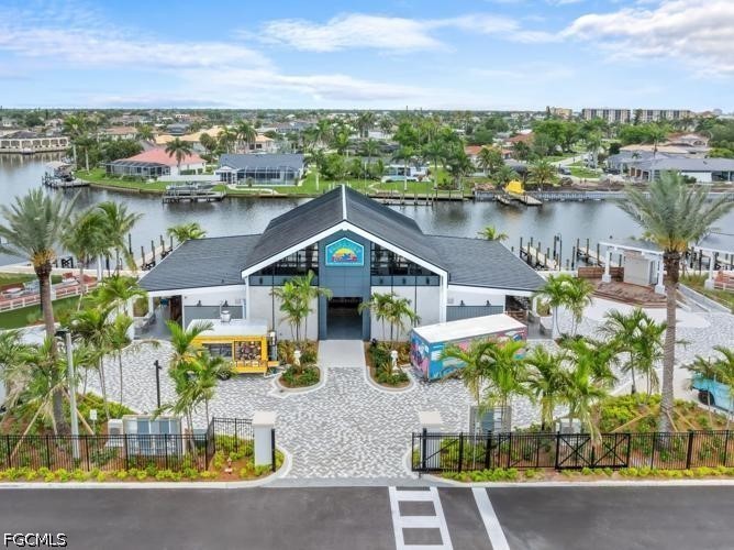 1524 Southwest 57th Street Cape Coral, FL 33914 - Photo 43 of 45 an aerial view of a house with outdoor seating a lake view