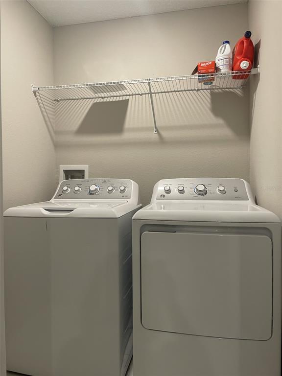 11901 Castine Street New Port Richey, FL 34654 - Photo 16 of 27 a utility room with dryer and washer
