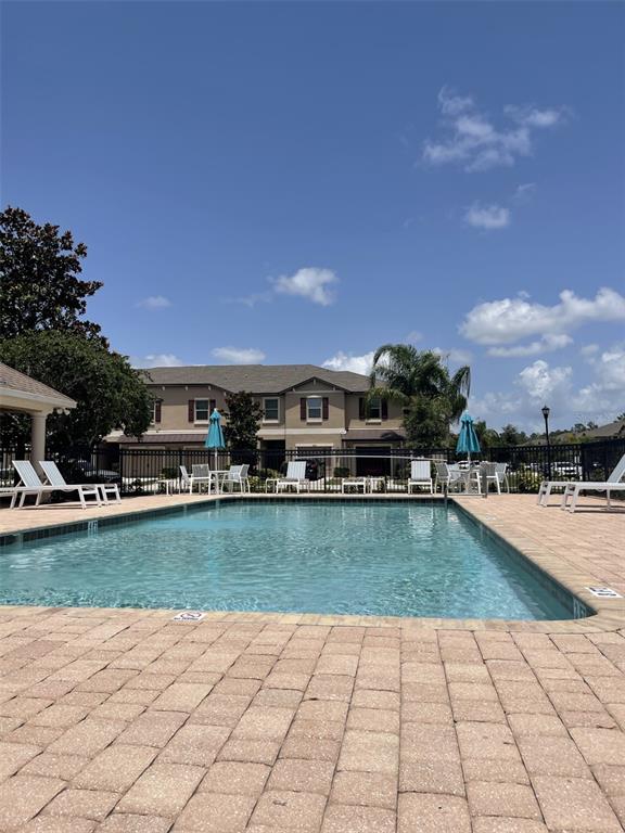11901 Castine Street New Port Richey, FL 34654 - Photo 26 of 27 a view of a swimming pool and lounge chair