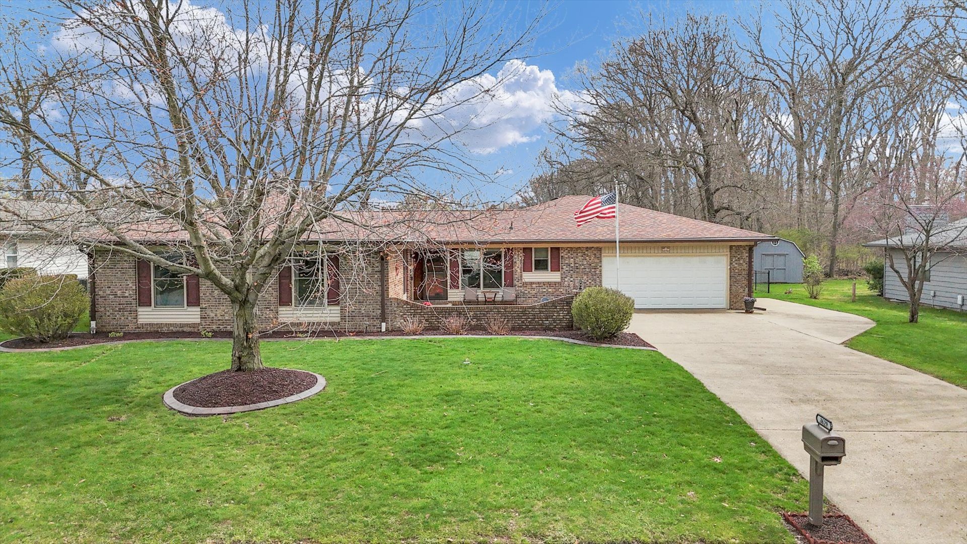 3629 Tuttle Street Danville, IL 61832 - Photo 1 of 47 a front view of a house with a yard and large tree