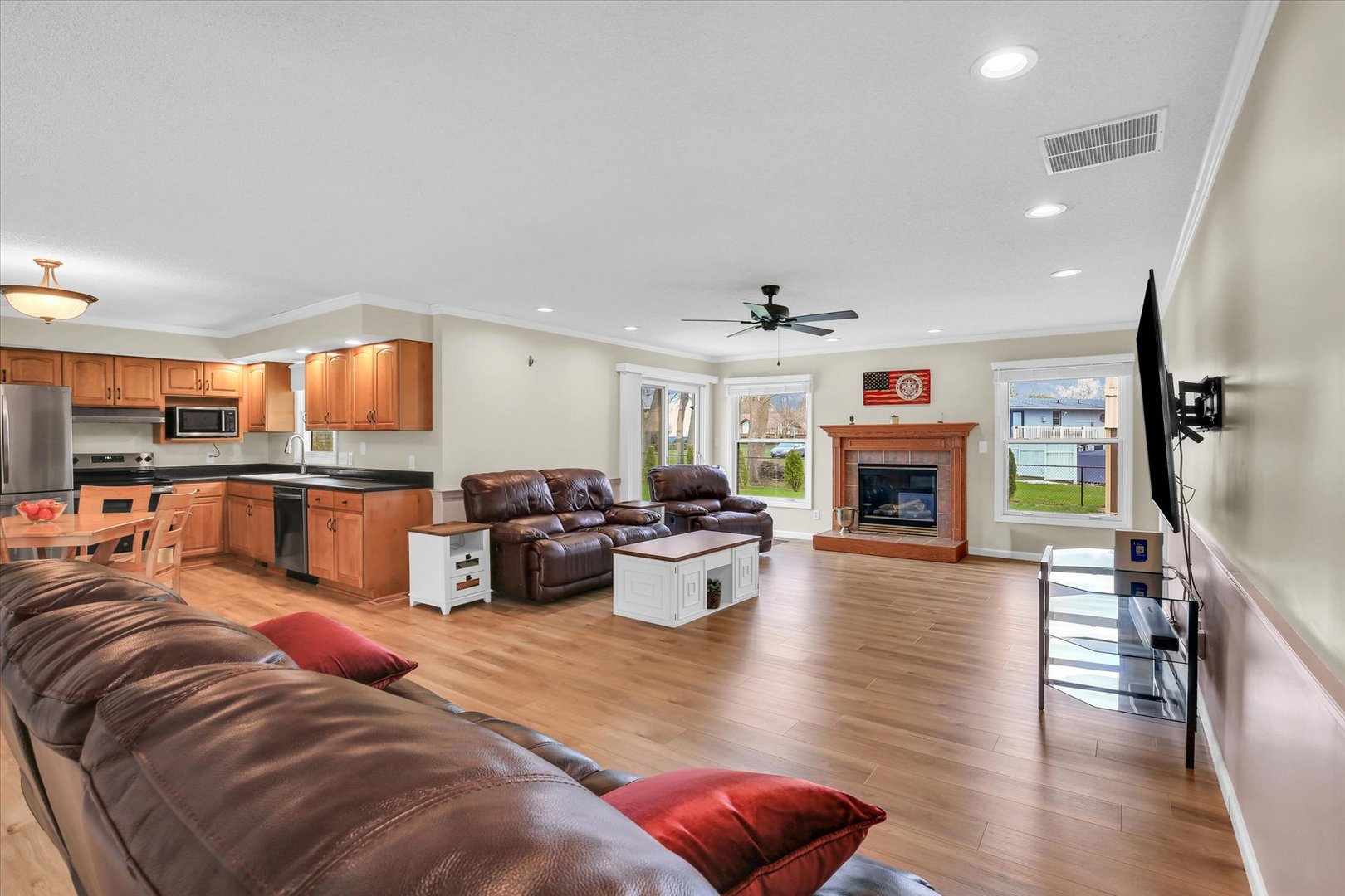 3629 Tuttle Street Danville, IL 61832 - Photo 11 of 47 a living room with furniture kitchen view and a fireplace
