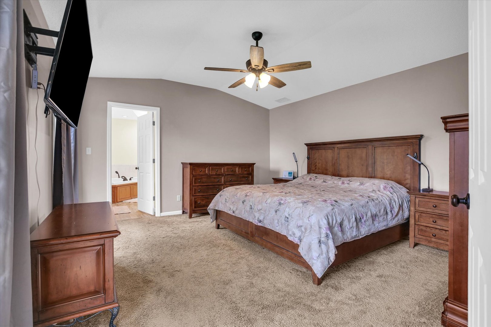 3629 Tuttle Street Danville, IL 61832 - Photo 19 of 47 a bedroom with a large bed and a fireplace