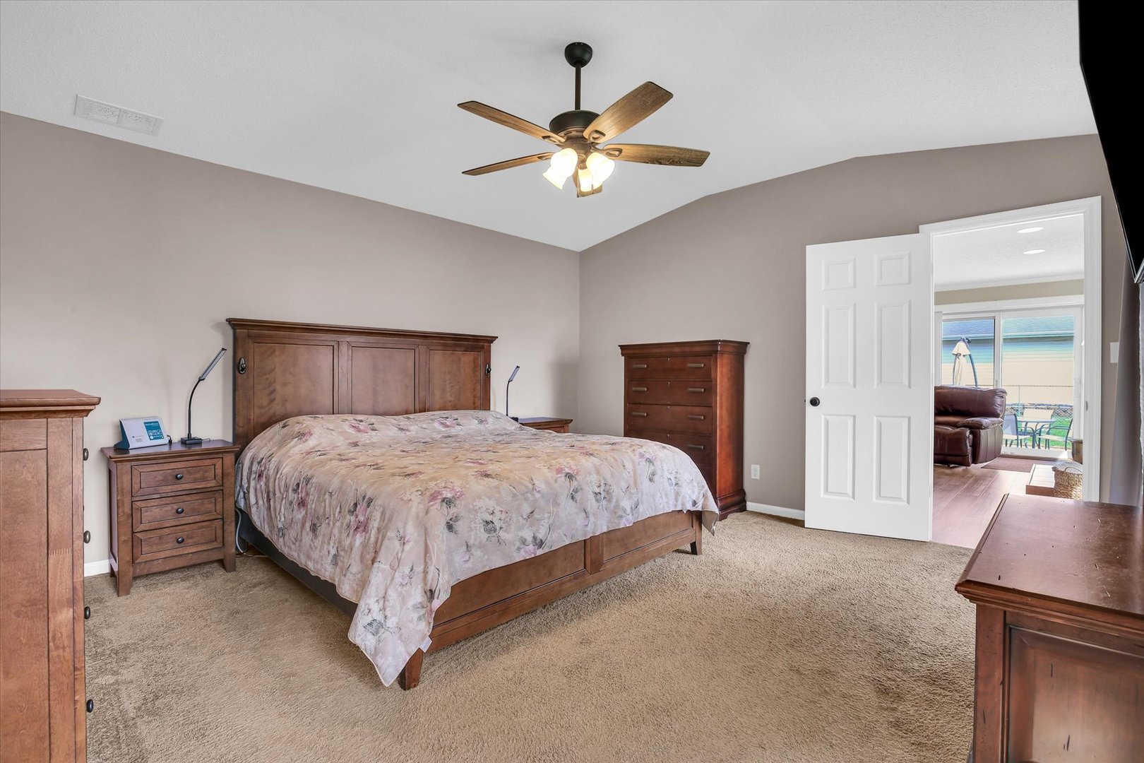 3629 Tuttle Street Danville, IL 61832 - Photo 20 of 47 a bedroom with a large bed and a chandelier