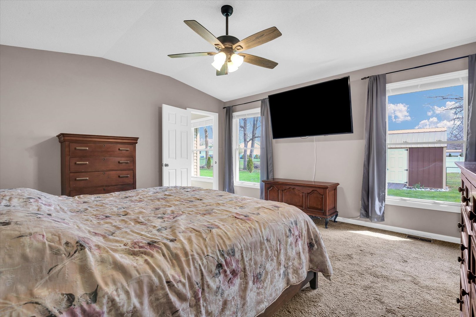 3629 Tuttle Street Danville, IL 61832 - Photo 21 of 47 a spacious bedroom with a bed and a flat screen tv
