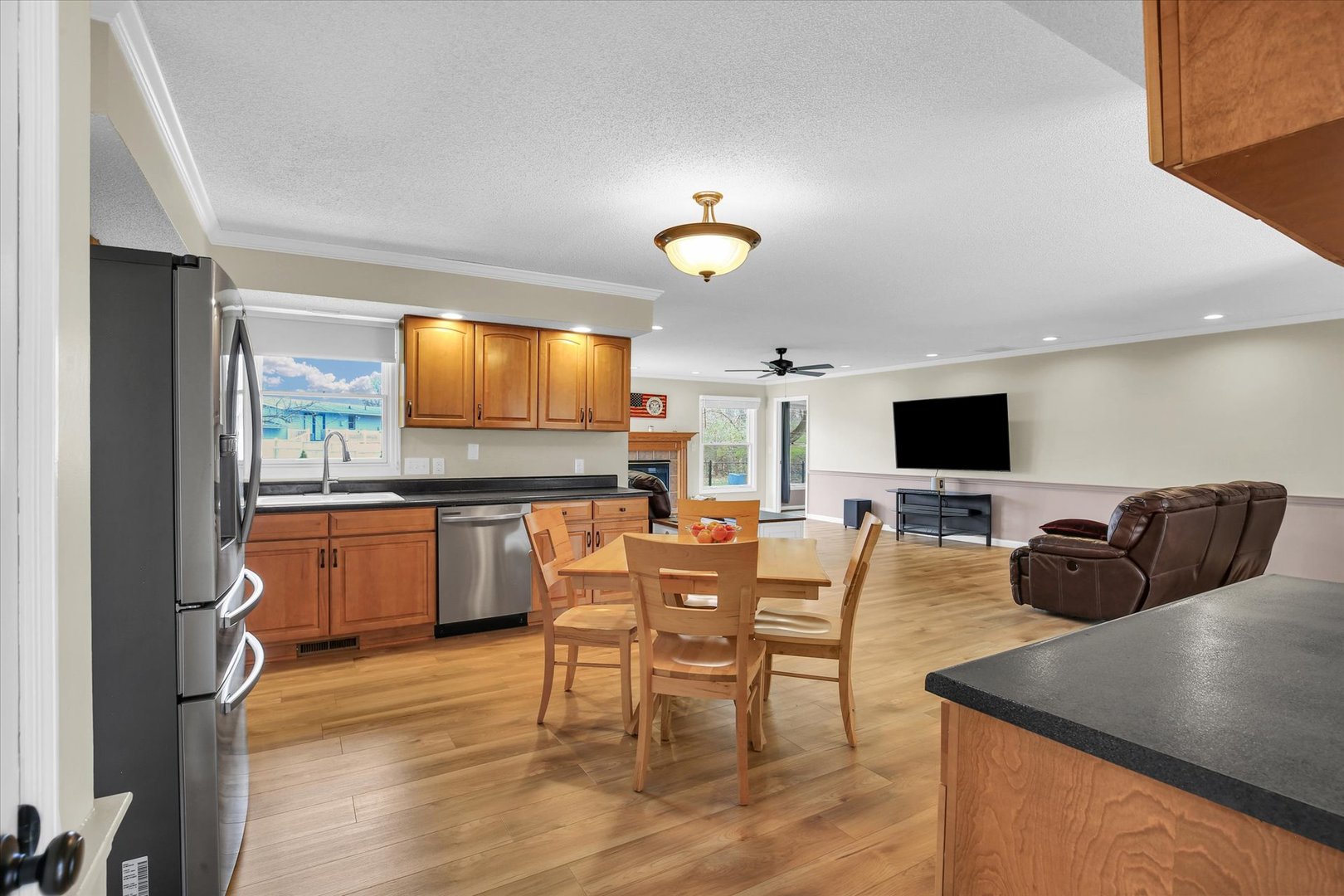 3629 Tuttle Street Danville, IL 61832 - Photo 6 of 47 a kitchen with stainless steel appliances kitchen island granite countertop a table and chairs in it
