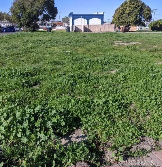 117 South I Lompoc, CA 93436 - Photo 12 of 13 a view of a big yard with a house and large trees