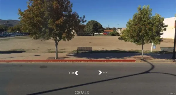 a view of a road with a building in the background