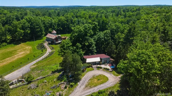 an aerial view of a house with a garden