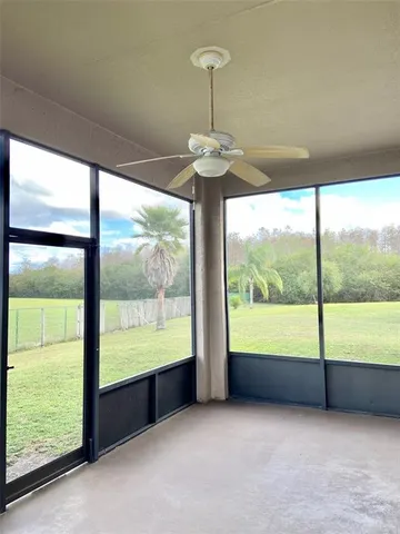 a view of an empty room with a large window