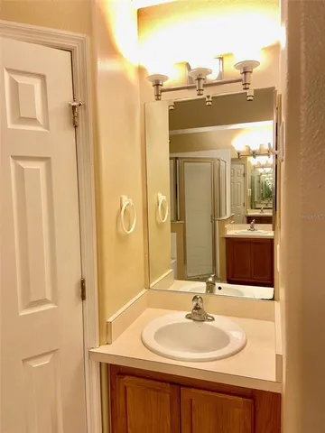 a bathroom with a sink and a mirror