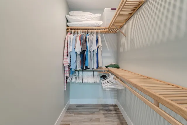a view of a room with wooden floor and stairs